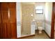 Bathroom with tile shower and toilet at 13425 Bonita Ave, Spring Hill, FL 34609