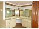 Bathroom with large vanity, double sinks and multiple mirrors at 13425 Bonita Ave, Spring Hill, FL 34609
