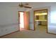 View of bedroom with doorway to bathroom, and floral wallpaper accents at 13425 Bonita Ave, Spring Hill, FL 34609