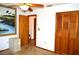 Spacious bedroom featuring a closet with doors, ceiling fan with light, and neutral wall color at 13425 Bonita Ave, Spring Hill, FL 34609