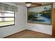 Bedroom featuring a window, fan and neutral walls, ready for your personal touches at 13425 Bonita Ave, Spring Hill, FL 34609