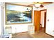 View of bedroom featuring a ceiling fan, painting, and adjacent doorway at 13425 Bonita Ave, Spring Hill, FL 34609