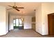 View of the dining room with ceiling fan and lighting, built-in cabinets, and sliding glass doors at 13425 Bonita Ave, Spring Hill, FL 34609