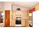 Bright eat-in kitchen featuring wood cabinets and modern appliances at 13425 Bonita Ave, Spring Hill, FL 34609