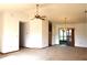 Spacious living room with ceiling fan, recessed lighting, and sliding doors to the outside at 13425 Bonita Ave, Spring Hill, FL 34609