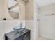 Elegant bathroom with a vessel sink and a step-in shower with tiled walls at 1402 Tallahassee Dr, Tarpon Springs, FL 34689