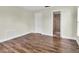 Bedroom with wood-look flooring and en suite bathroom at 1402 Tallahassee Dr, Tarpon Springs, FL 34689