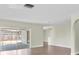 Light-filled living room with sliding glass doors that provide easy access to the outdoor patio at 1402 Tallahassee Dr, Tarpon Springs, FL 34689