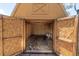 Interior view of a wooden storage shed with the double doors open to the backyard at 1402 Tallahassee Dr, Tarpon Springs, FL 34689