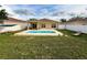 Backyard with a pool, lawn, and patio space offers a great outdoor entertainment area at 15205 Durango Cir, Brooksville, FL 34604