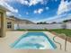 Inviting backyard with private pool, fenced perimeter, and sunny lawn space at 15205 Durango Cir, Brooksville, FL 34604