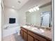 This bathroom features a double sink vanity, soaking tub, and walk-in shower at 15205 Durango Cir, Brooksville, FL 34604