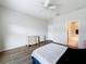 This bedroom has wood floors, is adjacent to a bathroom, and plenty of space for storage at 15205 Durango Cir, Brooksville, FL 34604
