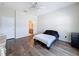 This bedroom features wood floors, is adjacent to a bathroom, and has plenty of natural light at 15205 Durango Cir, Brooksville, FL 34604
