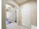 This hallway features tile floors and access to multiple rooms at 15205 Durango Cir, Brooksville, FL 34604