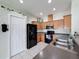 The spacious kitchen features wooden cabinets, a breakfast bar, and modern appliances for efficient cooking at 15205 Durango Cir, Brooksville, FL 34604