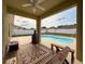 Inviting covered patio with a view of the sparkling in-ground pool at 15205 Durango Cir, Brooksville, FL 34604