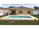Backyard pool featuring a patio, great for outdoor dining and relaxation, with clear blue water at 15205 Durango Cir, Brooksville, FL 34604