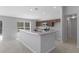 Modern kitchen featuring stainless appliances, breakfast bar, granite countertops and dark wood cabinets at 15291 Green Jay Rd, Weeki Wachee, FL 34614