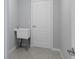 Laundry room with basin sink and tile floors at 15291 Green Jay Rd, Weeki Wachee, FL 34614