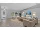 Virtually staged living room with tile floors, neutral walls, and stylish furniture offers a comfortable living space at 15291 Green Jay Rd, Weeki Wachee, FL 34614
