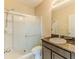 Standard bathroom featuring a walk-in shower, granite counter tops, and neutral colored walls at 15846 Stable Run Dr, Spring Hill, FL 34610