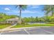 Community pool area featuring a gazebo, lounge chairs, and a surrounding fence at 15846 Stable Run Dr, Spring Hill, FL 34610
