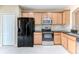 Well-equipped kitchen featuring stainless steel appliances and ample cabinet space at 15846 Stable Run Dr, Spring Hill, FL 34610