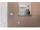 View of the modern kitchen through an open wall, complemented by a view of the screened patio at 15846 Stable Run Dr, Spring Hill, FL 34610