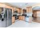 Well-appointed kitchen featuring stainless steel appliances, granite countertops, and ample cabinet space at 15846 Stable Run Dr, Spring Hill, FL 34610