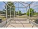 Screened lanai provides outdoor space and a view of the backyard at 15846 Stable Run Dr, Spring Hill, FL 34610