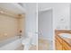 Bathroom featuring a tub, toilet, vanity and a separate area at 18644 Autumn Lake Blvd, Hudson, FL 34667