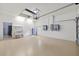 Spacious garage with sink, water heater and door leading to inside at 18644 Autumn Lake Blvd, Hudson, FL 34667