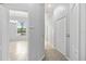 Hallway with access to a dining room and multiple closets at 18644 Autumn Lake Blvd, Hudson, FL 34667