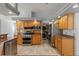 Well-equipped kitchen with wooden cabinets and stainless steel appliances at 18644 Autumn Lake Blvd, Hudson, FL 34667