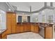 The kitchen offers granite countertops and a stainless steel dishwasher at 18644 Autumn Lake Blvd, Hudson, FL 34667