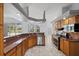 Spacious kitchen featuring granite countertops and wooden cabinetry at 18644 Autumn Lake Blvd, Hudson, FL 34667