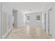 Bright, open living space featuring tile flooring and neutral walls at 18644 Autumn Lake Blvd, Hudson, FL 34667