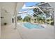 Screened-in pool featuring a spa and room for outdoor seating at 18644 Autumn Lake Blvd, Hudson, FL 34667