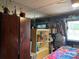 Bedroom featuring a large wardrobe and shelving units, optimizing storage and organization at 1983 Abrico Dr # H-9, Lutz, FL 33558