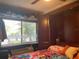 Cozy bedroom with a Murphy bed, storage, and window with natural light at 1983 Abrico Dr # H-9, Lutz, FL 33558