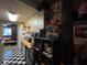 View of kitchen with appliances, wood countertop, and black and white checkered flooring at 1983 Abrico Dr # H-9, Lutz, FL 33558