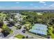 Aerial view of The Groves with golf course, pool, and tennis courts at 20720 Eustis Rd, Land O Lakes, FL 34637