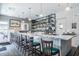 Bright bar with marble countertop, shelving with drinks, and comfortable seating at 20720 Eustis Rd, Land O Lakes, FL 34637