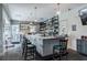 Elegant bar featuring marble countertop, full shelving, and comfortable seating at 20720 Eustis Rd, Land O Lakes, FL 34637