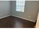 Cozy bedroom with hardwood floors and a window for natural light at 20720 Eustis Rd, Land O Lakes, FL 34637