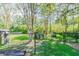 A fenced dog park with benches and shade, providing a secure and pleasant environment for pets and owners at 20720 Eustis Rd, Land O Lakes, FL 34637