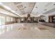 This large event hall features a stage, fireplace, and neutral decor, perfect for hosting gatherings and celebrations at 20720 Eustis Rd, Land O Lakes, FL 34637
