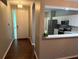 Home foyer and kitchen featuring neutral countertops and stainless appliances at 20720 Eustis Rd, Land O Lakes, FL 34637