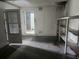Unfinished basement space with shelves and a door leading to the rest of the house at 2083 Envoy Ct, Clearwater, FL 33764